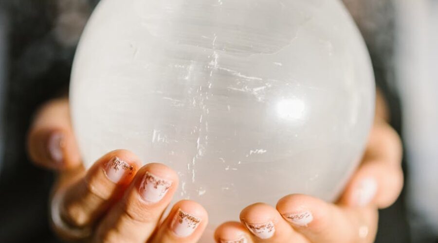 person holding white round ball